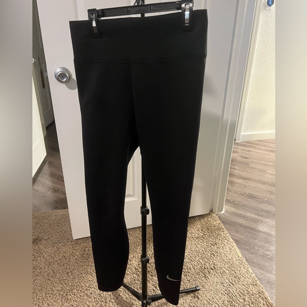 Nike leggings, black, flat hem, sleek texture